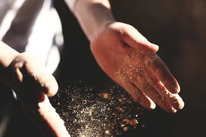 Baker tossing dough cookbook cover